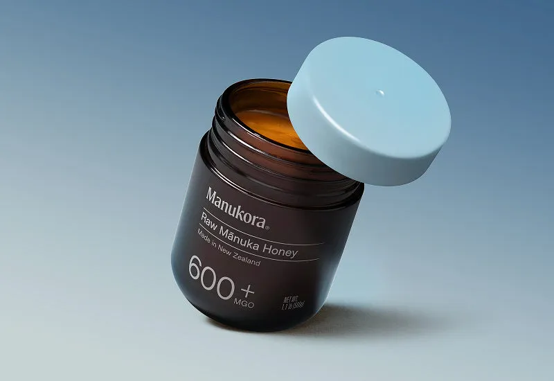MGO 600+ Amber Glass Jar — Angled View